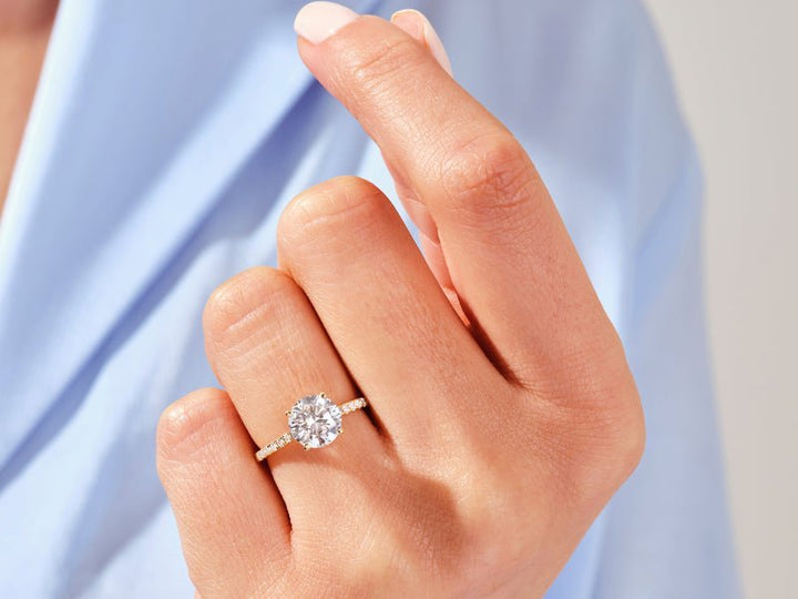 Top-down view of round cut pave engagement ring