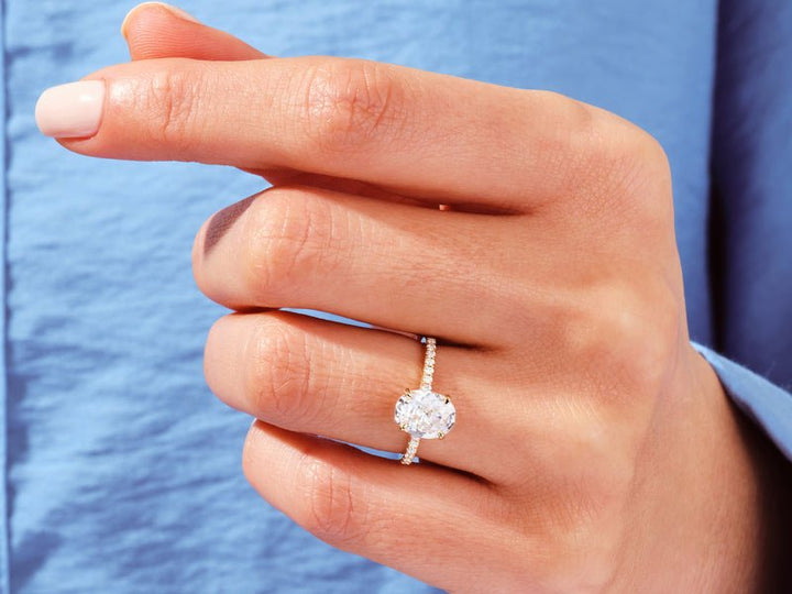 Oval pave engagement ring viewed from the side