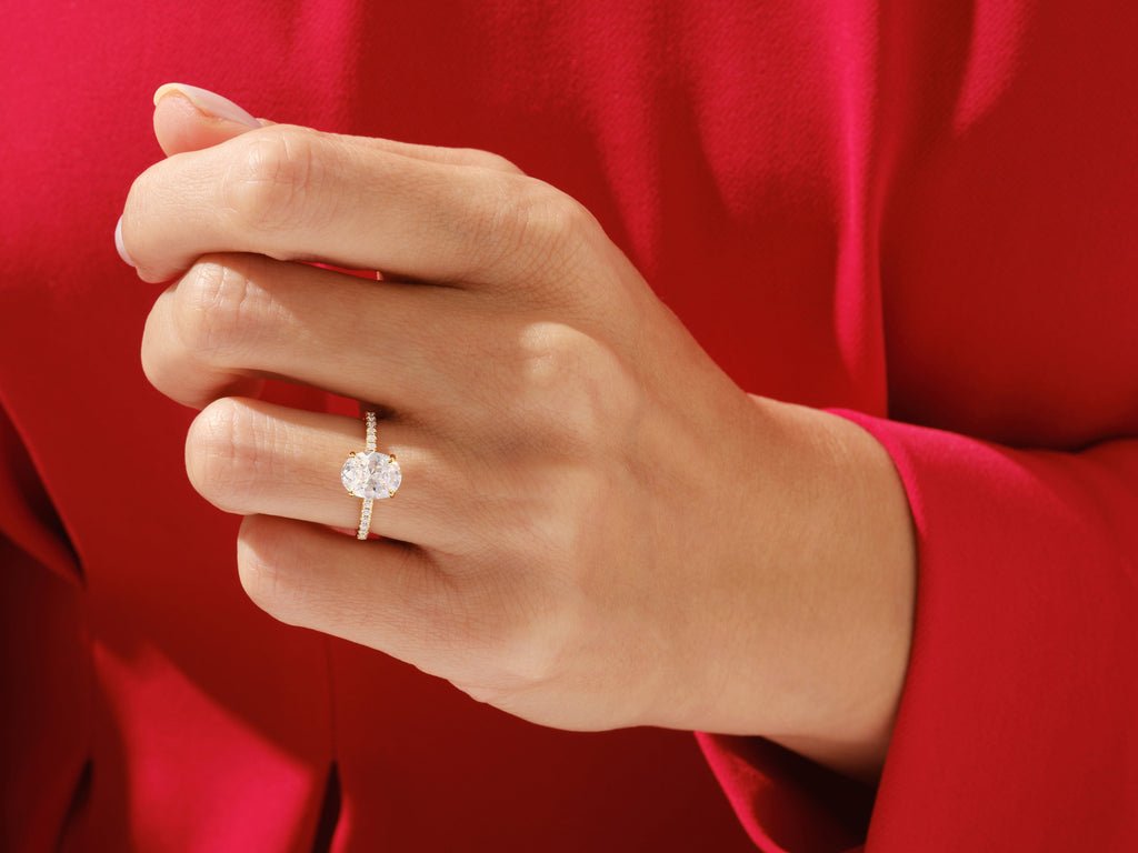Profile view of oval cut pave engagement ring band