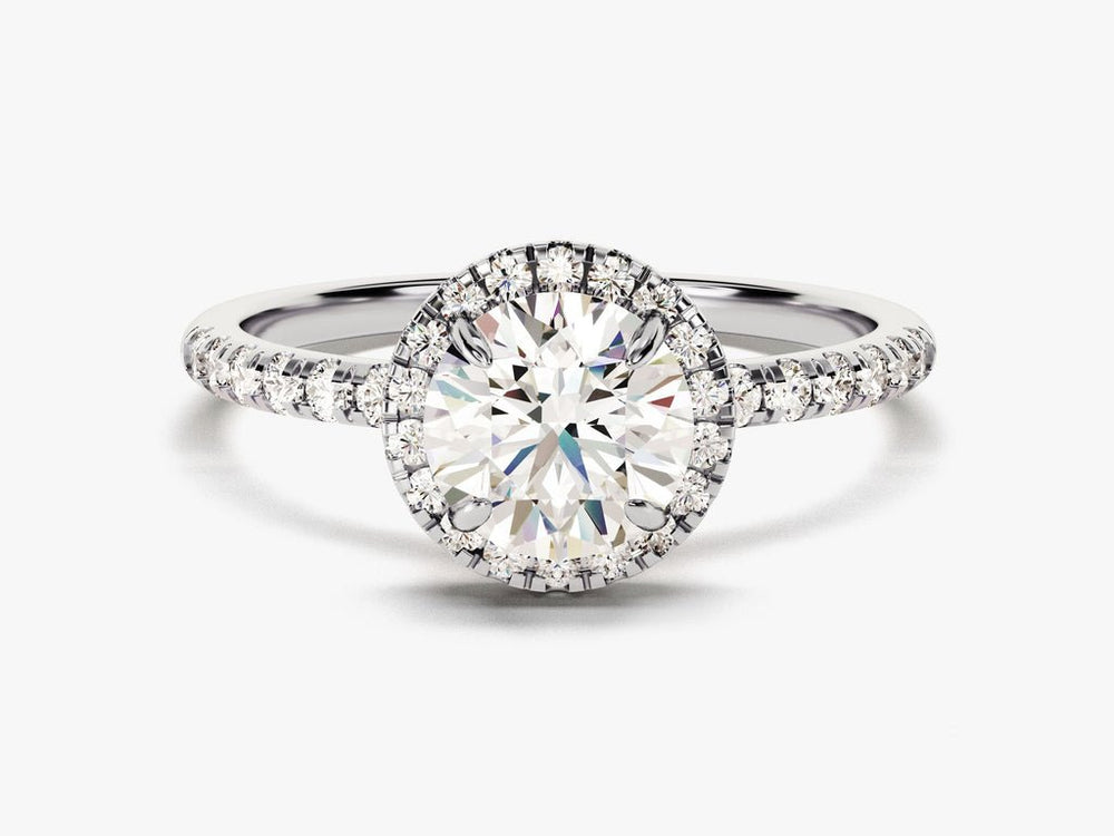 Round cut diamond ring worn on hand