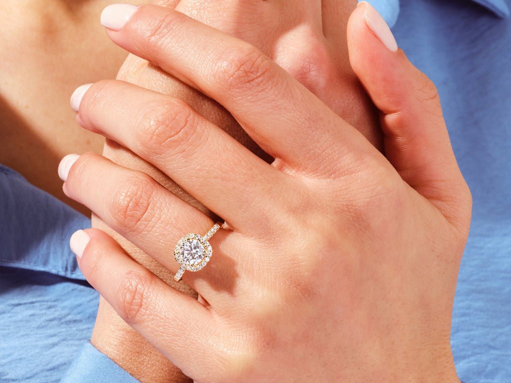 Round pave engagement ring close-up highlighting diamond sparkle