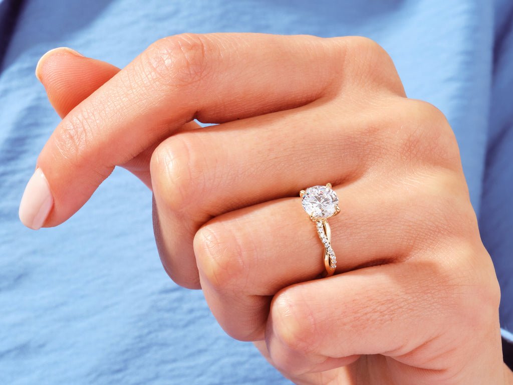 Round solitaire engagement ring viewed from the side