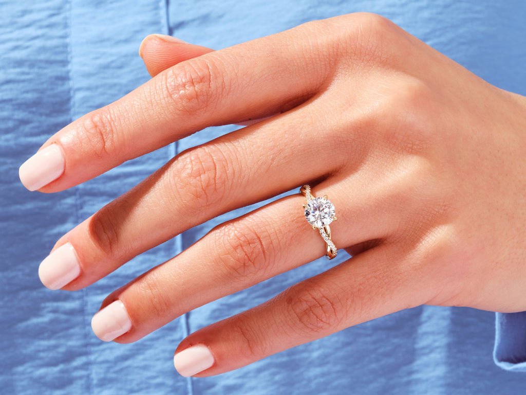 Profile view of round cut solitaire engagement ring band