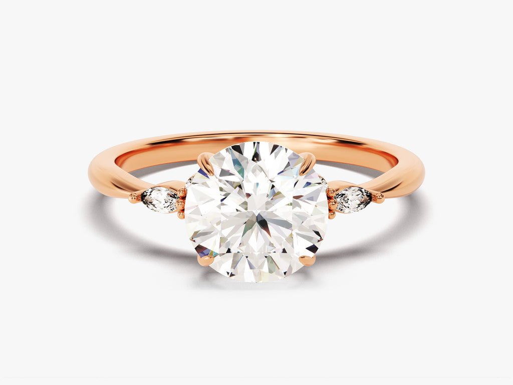Round three stone lab grown diamond ring fitted on finger