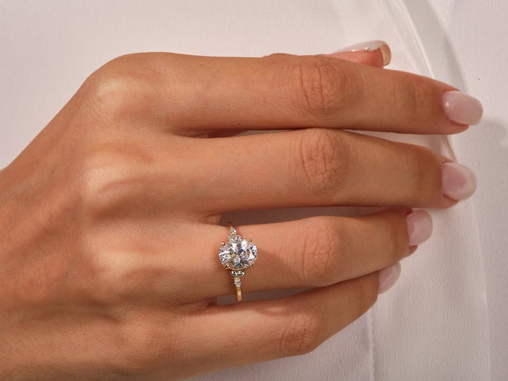Side angle of oval three stone diamond engagement ring