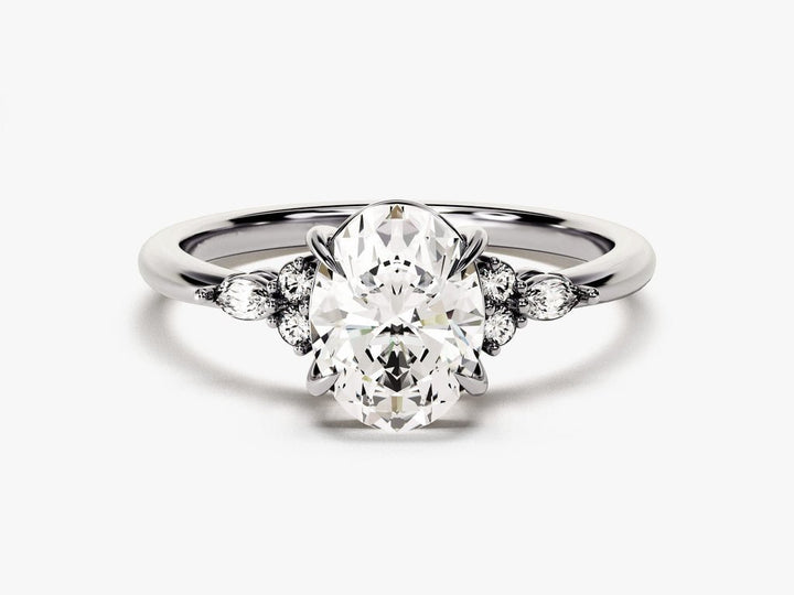 Macro shot of oval cut diamond facets in three stone ring setting