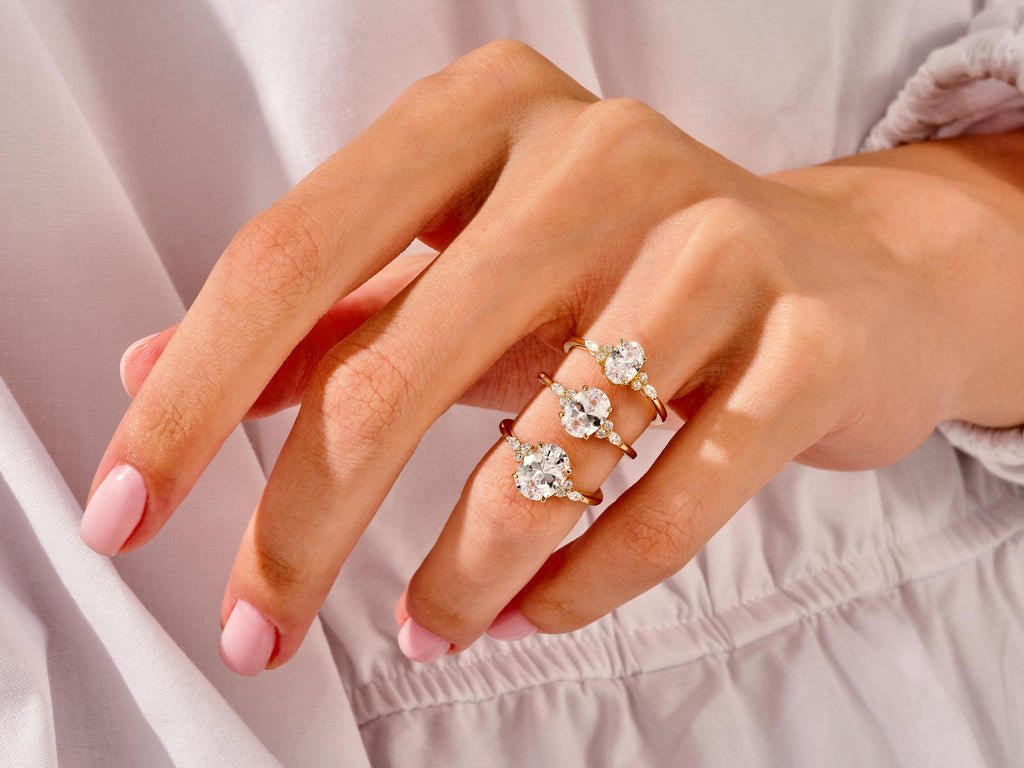 Oval three stone lab grown diamond ring side profile in gold setting