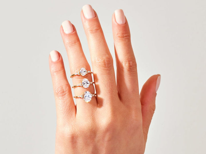 Profile view of oval cut three stone engagement ring band