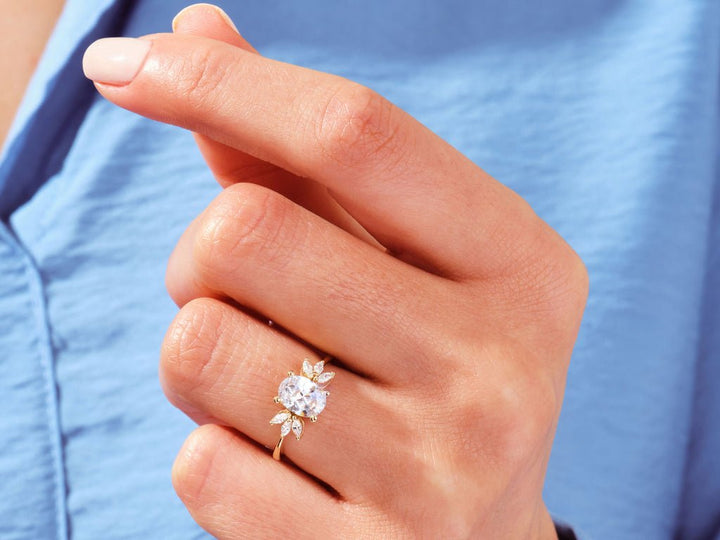 Profile view of oval cut cluster engagement ring band