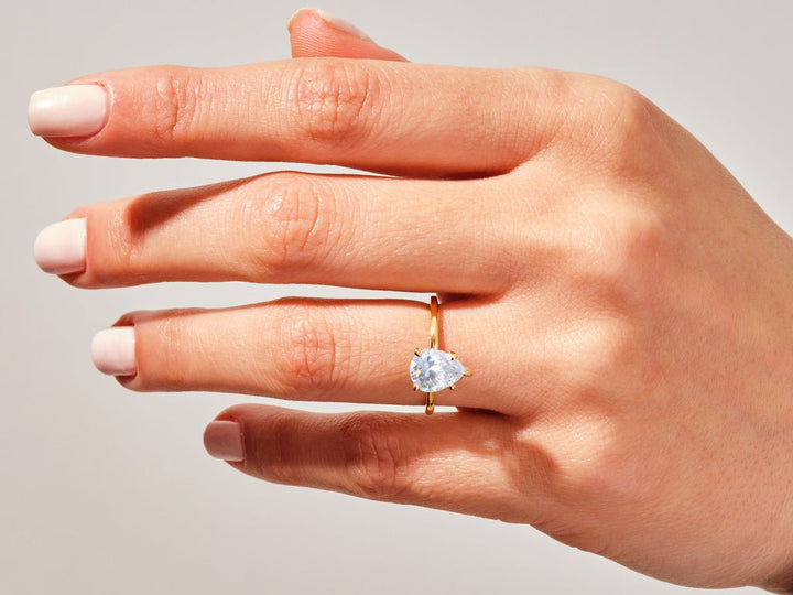 Pear cut engagement ring side view showing band detail