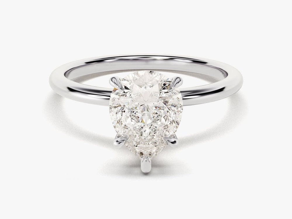 Close-up of pear cut center diamond in solitaire engagement ring