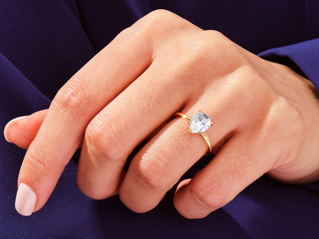 Side angle of pear solitaire diamond engagement ring