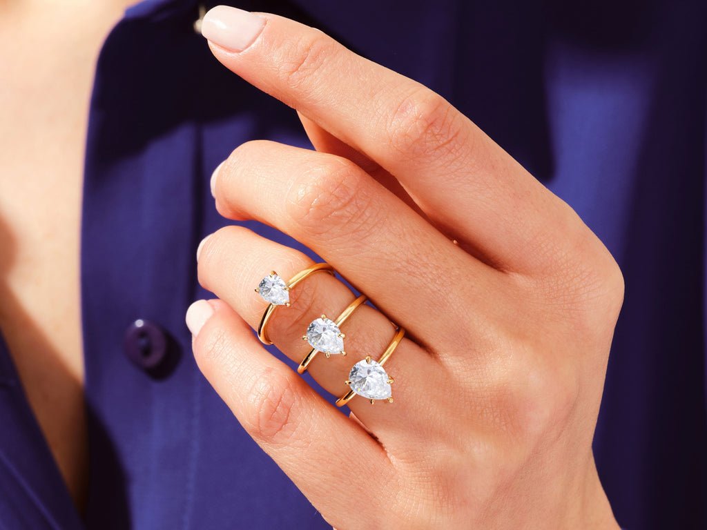 Detailed close-up of pear solitaire diamond engagement ring