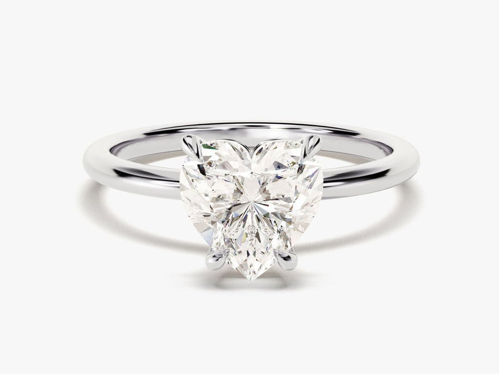 Heart cut engagement ring shown with authenticity certificate