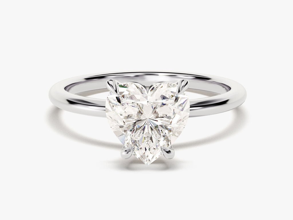 Heart cut engagement ring shown with authenticity certificate