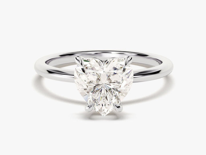 Heart cut engagement ring shown with authenticity certificate