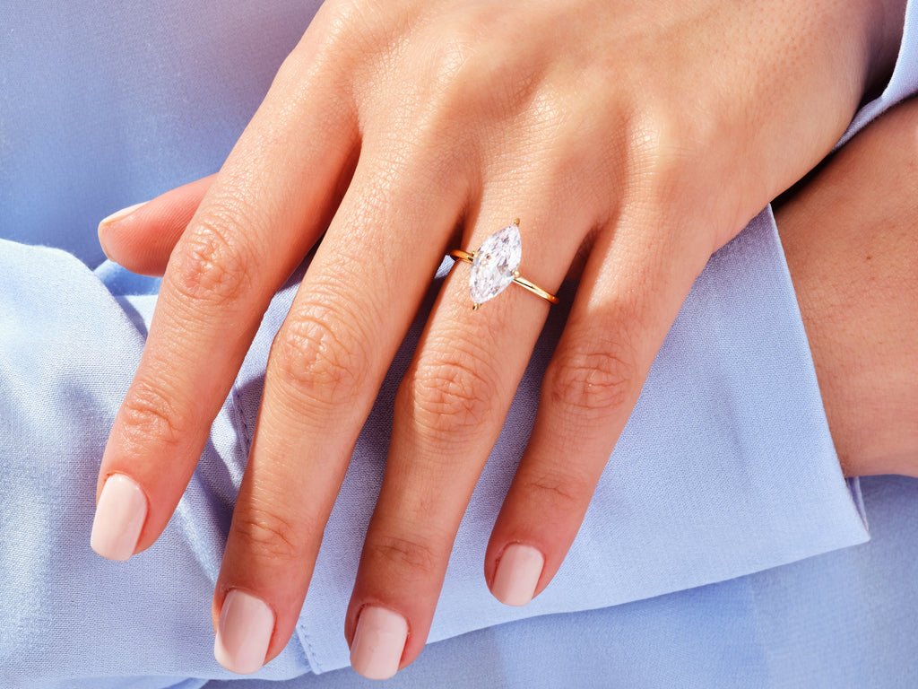Profile view of marquise cut solitaire engagement ring band