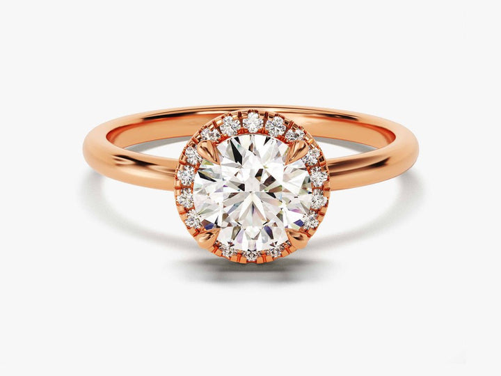 Round cut diamond ring worn on hand