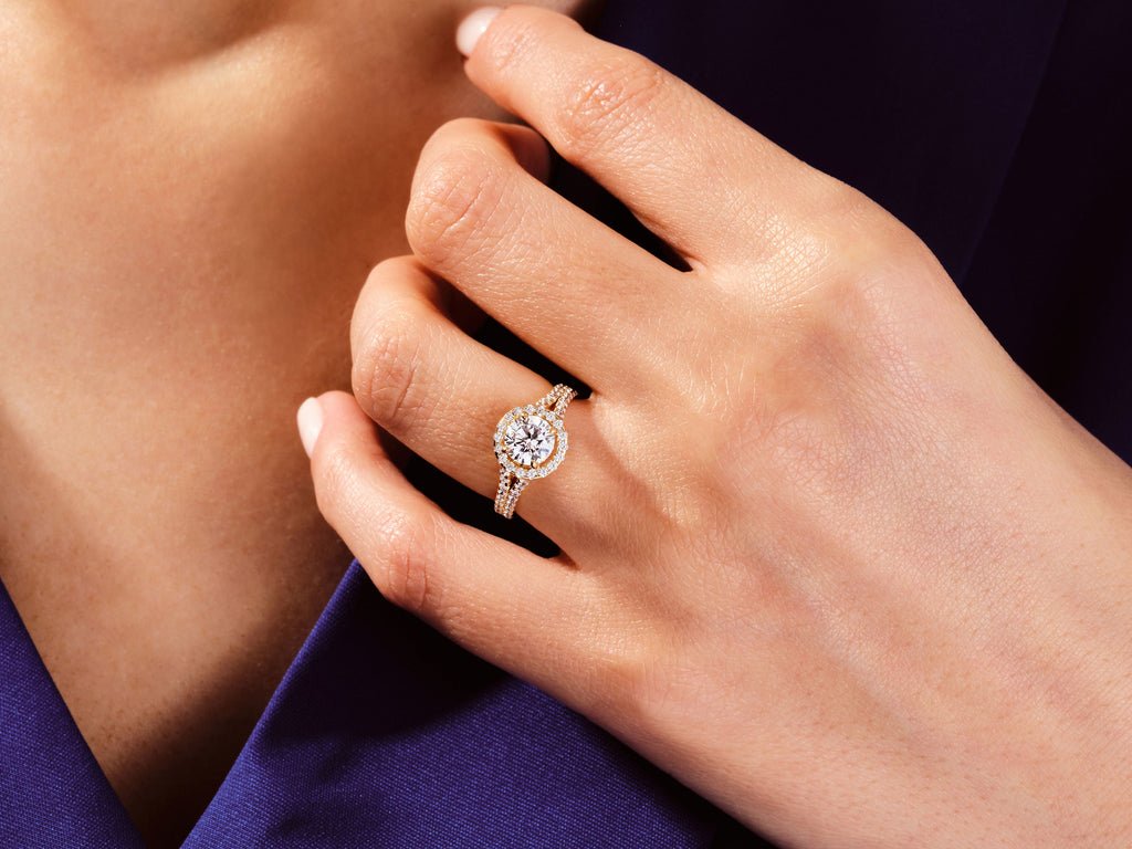 Round solitaire diamond ring displayed on jewelry stand