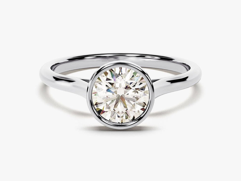 IGI certified round cut diamond in bezel engagement ring setting
