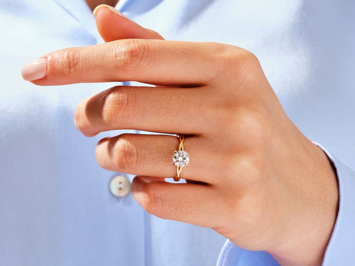 Side angle of round solitaire diamond engagement ring