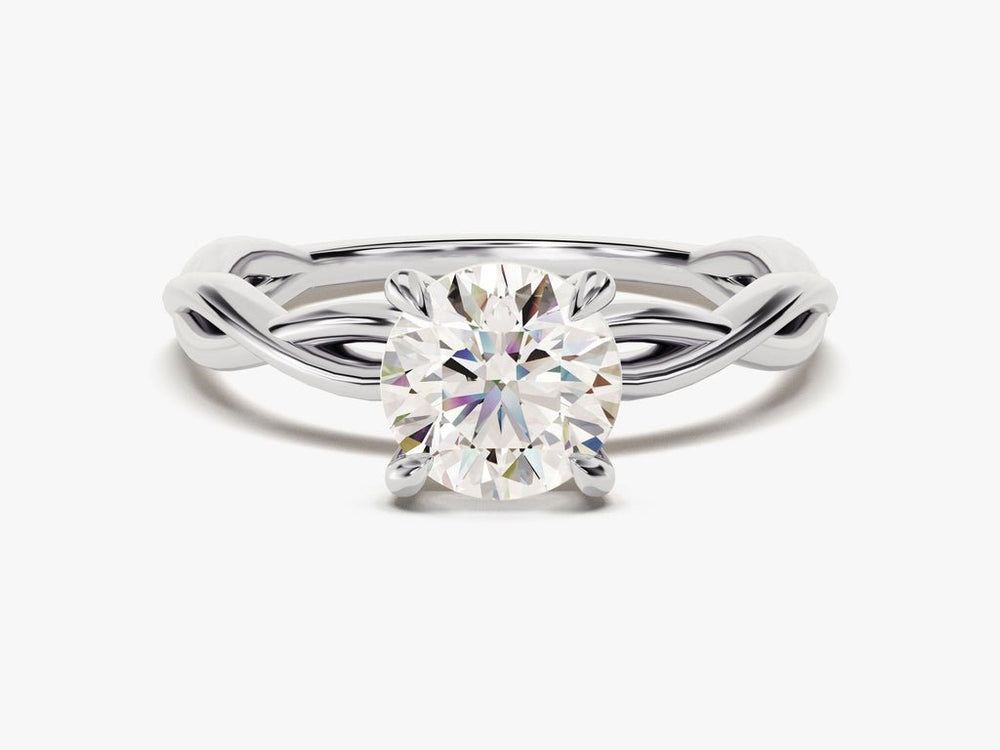 Close-up of round cut center diamond in solitaire engagement ring