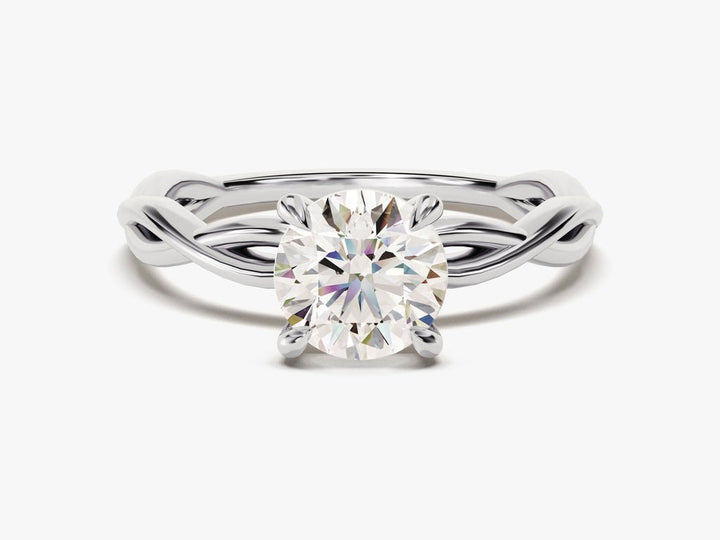 Close-up of round cut center diamond in solitaire engagement ring