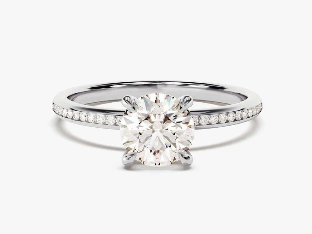 Round solitaire engagement ring shown on hand for true-to-life sizing