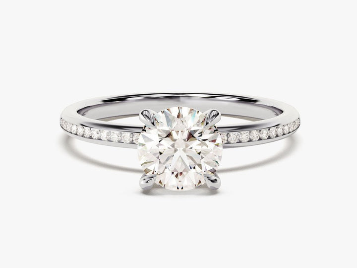 Round solitaire engagement ring shown on hand for true-to-life sizing
