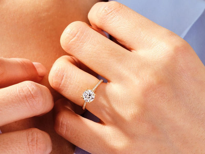 Round solitaire engagement ring offered in gold and platinum