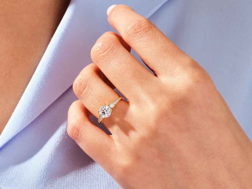 Profile view of round cut pave engagement ring band