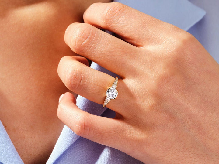 Round pave engagement ring viewed from the side