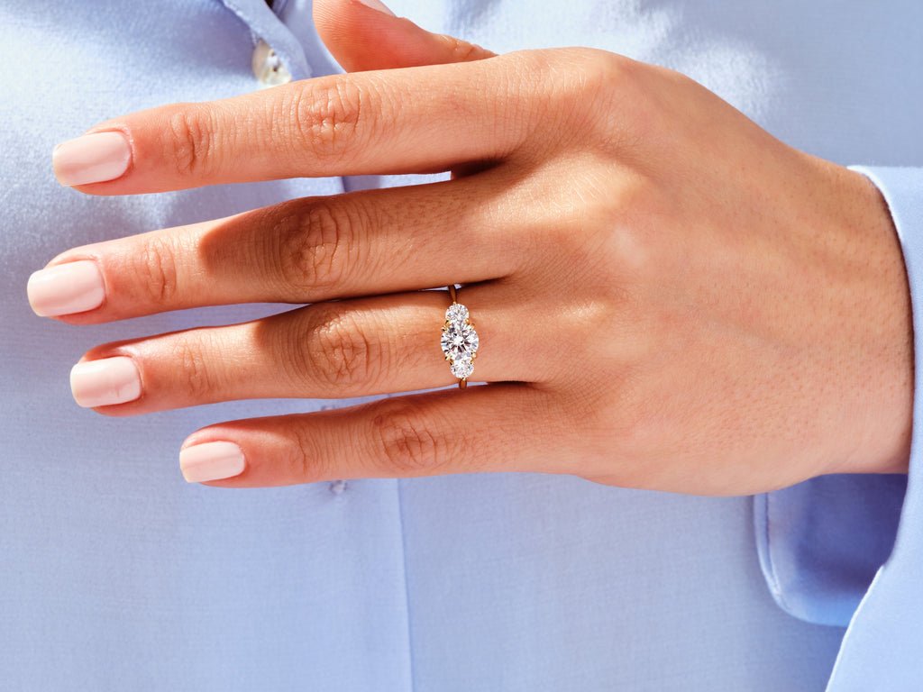 Detailed close-up of round solitaire diamond engagement ring