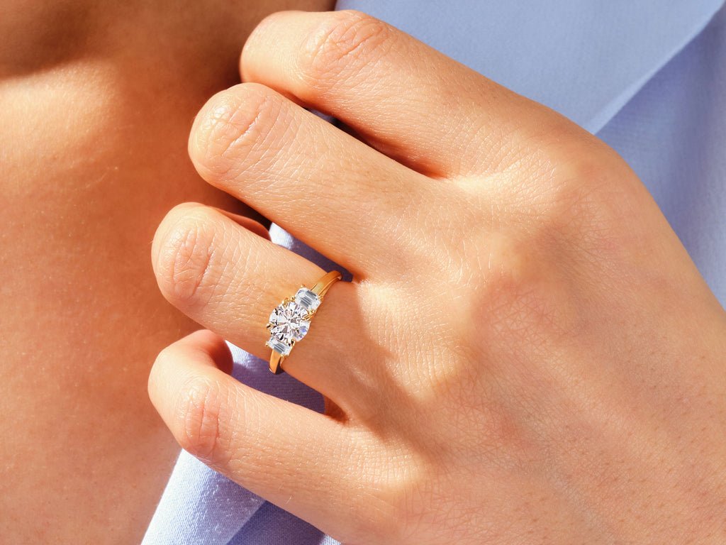 Round solitaire diamond ring presented in signature gift packaging