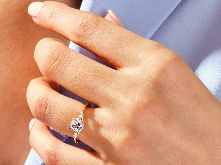Round solitaire engagement ring photographed in natural light