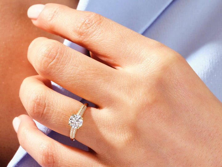 Detailed close-up of round pave diamond engagement ring