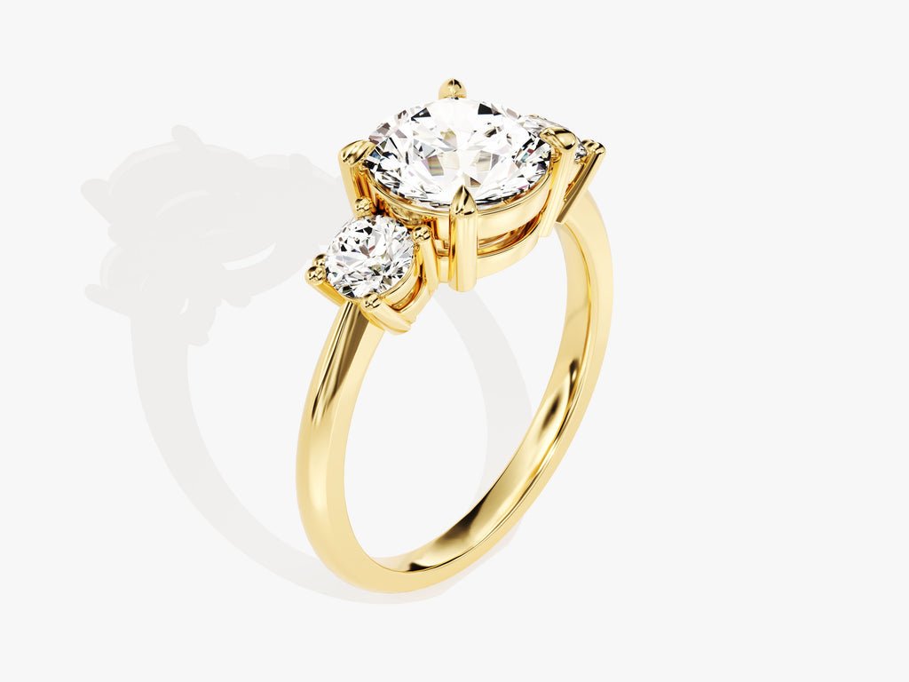 Close-up of round cut center diamond in three stone engagement ring