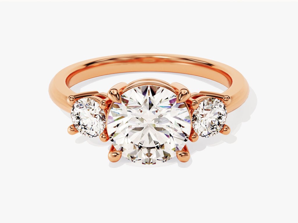 Round three stone engagement ring close-up showing high clarity diamond clarity