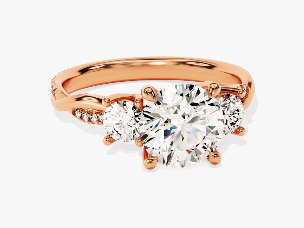 Round three stone diamond ring displayed on jewelry stand
