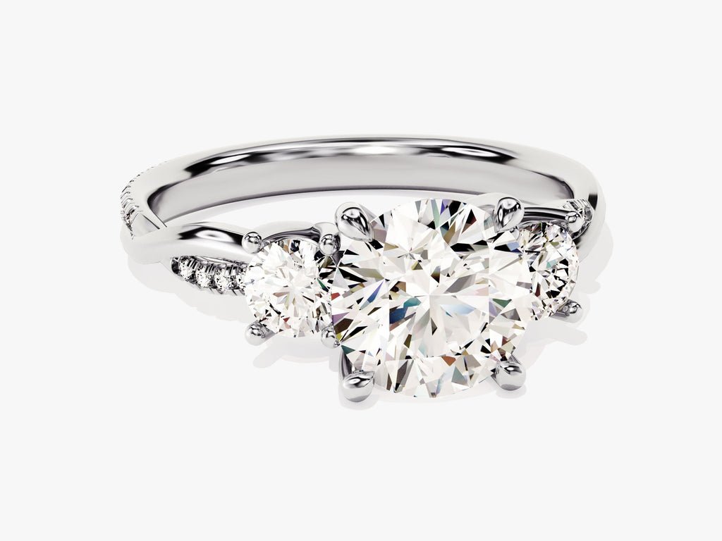Angled view of round cut diamond in three stone setting