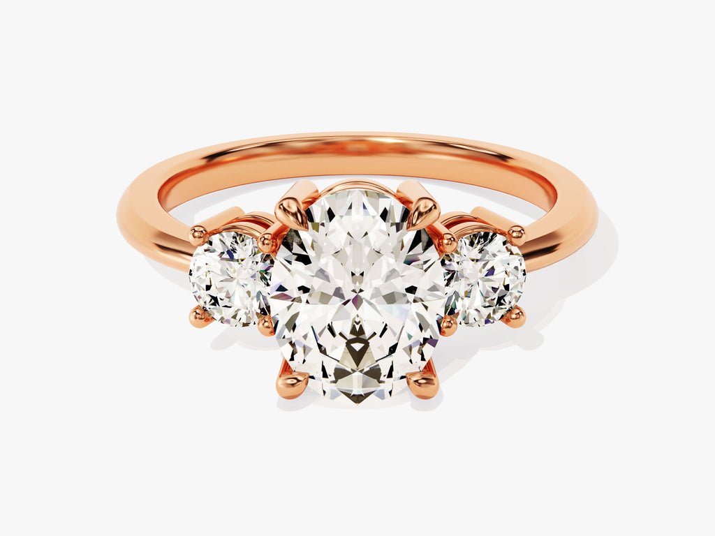 Oval three stone diamond ring displayed on jewelry stand