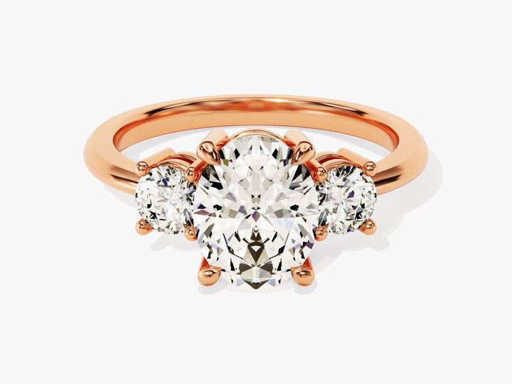 Oval three stone diamond ring displayed on jewelry stand
