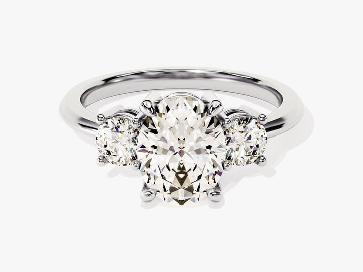 Top-down view of oval cut three stone engagement ring