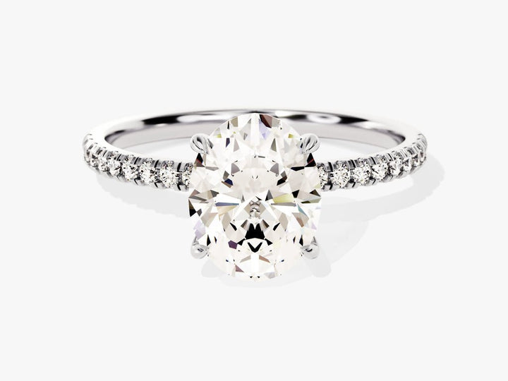 Close-up of oval cut center diamond in hidden halo engagement ring