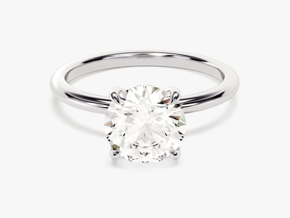 Angled view of round cut diamond in hidden halo setting
