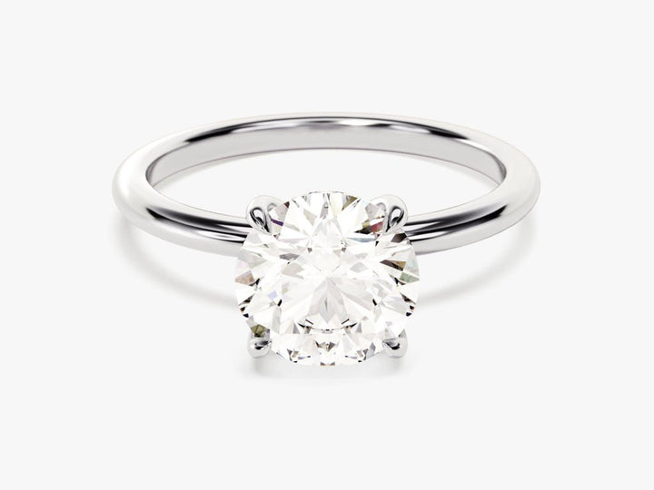 Angled view of round cut diamond in hidden halo setting