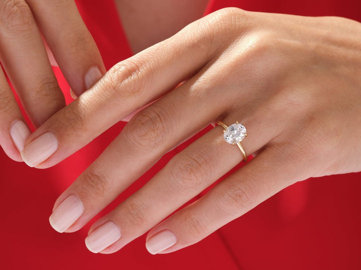 Oval hidden halo lab grown diamond ring in jewelry gift box
