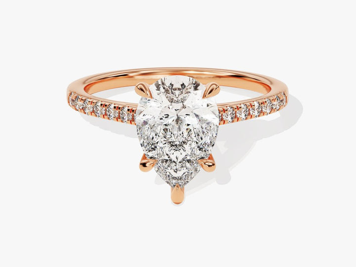 Detailed close-up of pear pave diamond engagement ring