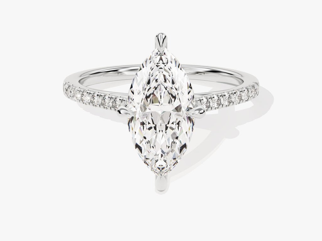Close-up of marquise cut center diamond in pave engagement ring