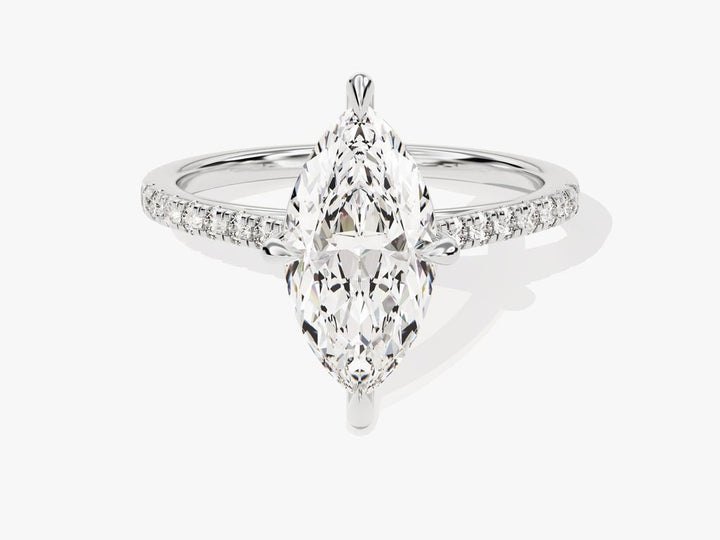 Close-up of marquise cut center diamond in pave engagement ring